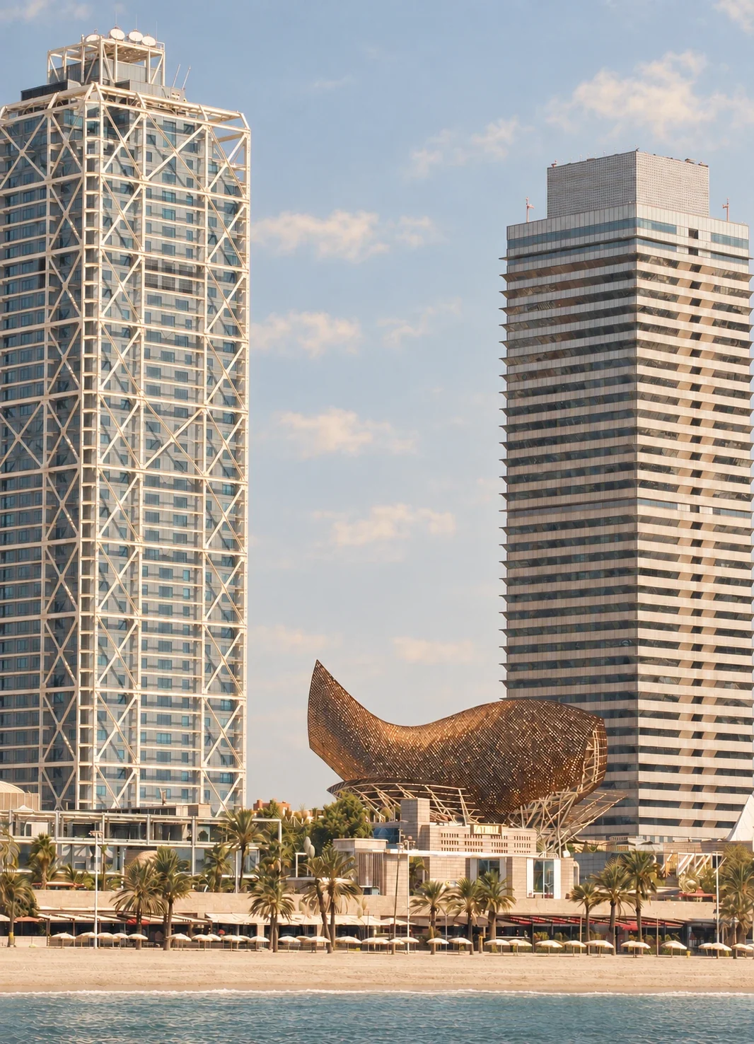 The twin towers and the golden Peix sculpture on the Barcelona seafront